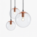 Suspension design boule en verre à LED rose gold ou noire